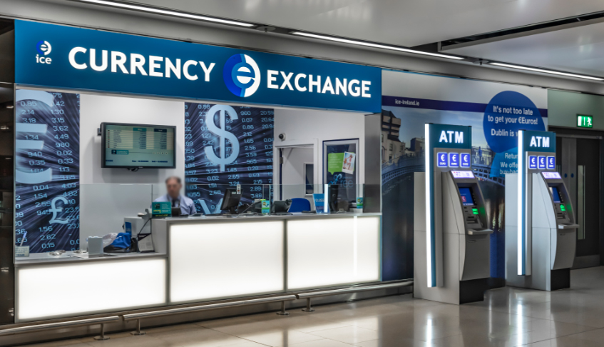 currency exchange unit with worker dublin airport