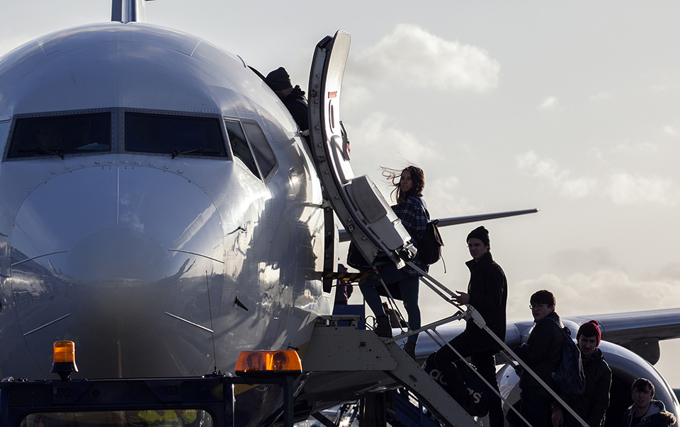 passengers boarding plane